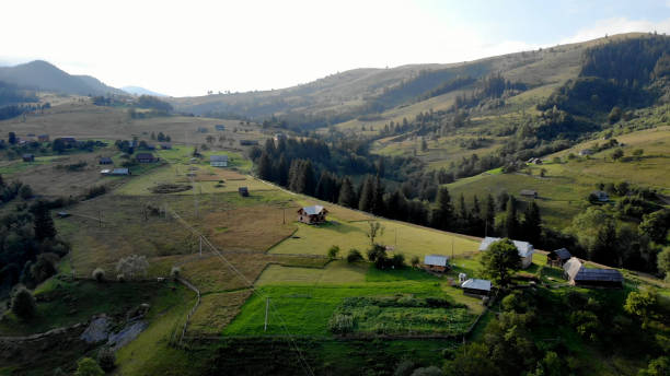 istock House fields meadows and trees on the mountainside. 1283361760