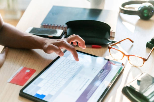 istock woman paying online shopping at digital tablet 1283363047