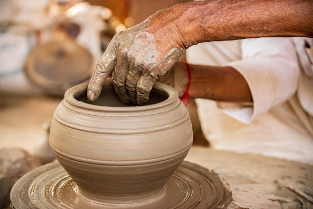 istock Potter at work makes ceramic dishes. India, Rajasthan. 1283363150