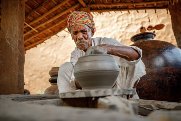 istock Potter at work makes ceramic dishes. India, Rajasthan. 1283363195