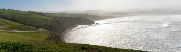 istock green grassy cliffs drop down to the ocean coast in northern Spain 1283363382