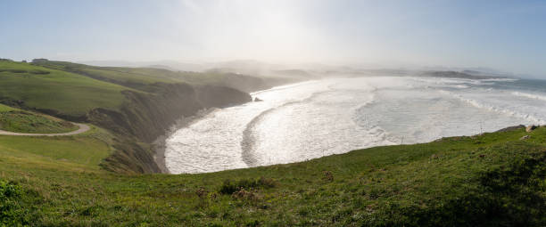 istock green grassy cliffs drop down to the ocean coast in northern Spain 1283364195