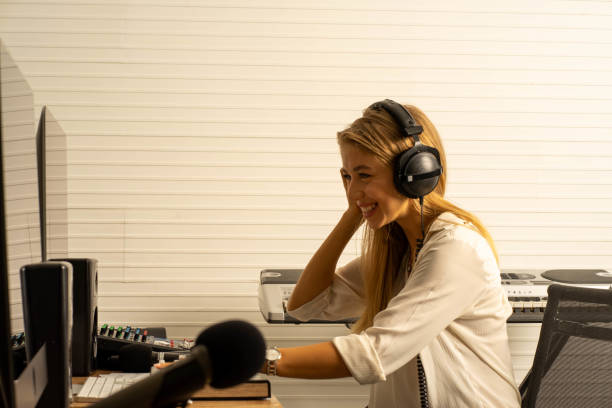 istock young attractive Caucasian woman musician singer in recoding studio with microphone. Performance arts concept. 1283365664