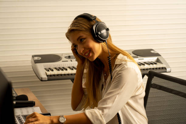 istock young attractive Caucasian woman musician singer in recoding studio with microphone. Performance arts concept. 1283365666