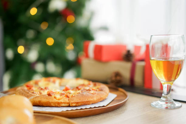 close up on hawaiian flavor pizza on plate with wineglass and lunch meal for prepare to celebration christmas festival concept - close to food and drink yummy food imagens e fotografias de stock