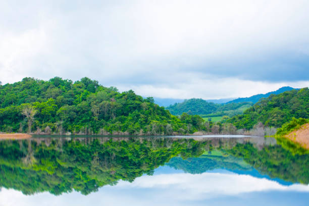 istock Reservoir in the valley with overcast sky and rain clouds 1283368287