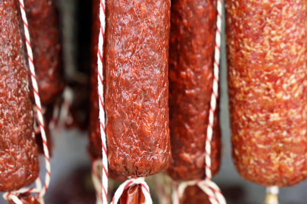 istock Sausage sticks are hanging in the store 1283368417