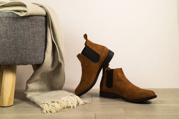 istock Women autumn shoes or boots on floor. 1283369714