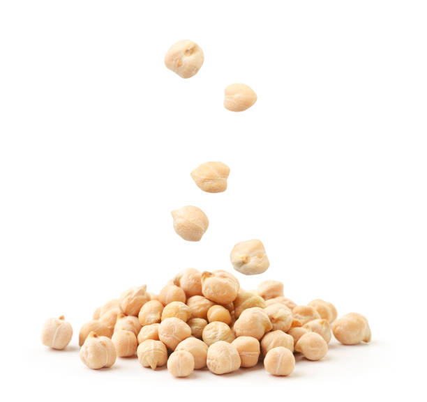 Chickpeas flies and falls on a bunch on a white background. Isolated