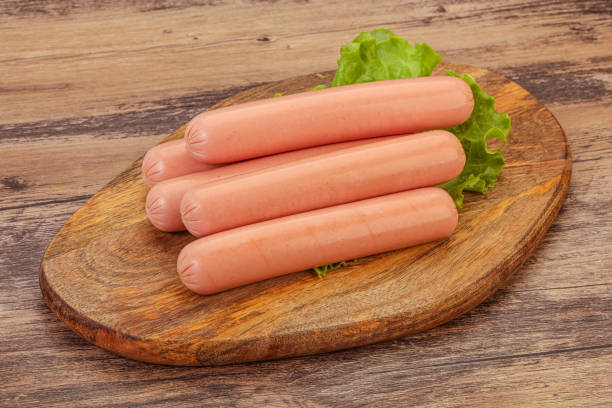 istock Tasty meat sausages over board 1283372616