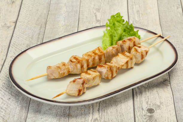 istock Grilled pork skewer served salad 1283373161