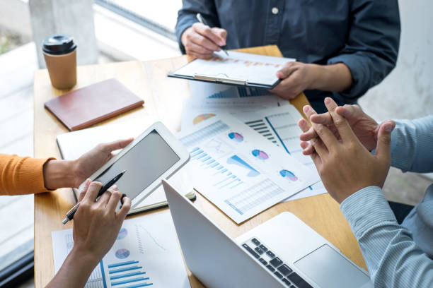 istock Business team collaboration discussing working analyzing with financial data and marketing growth report graph in team, presentation and brainstorming to strategy planning making profit of company 1283374007