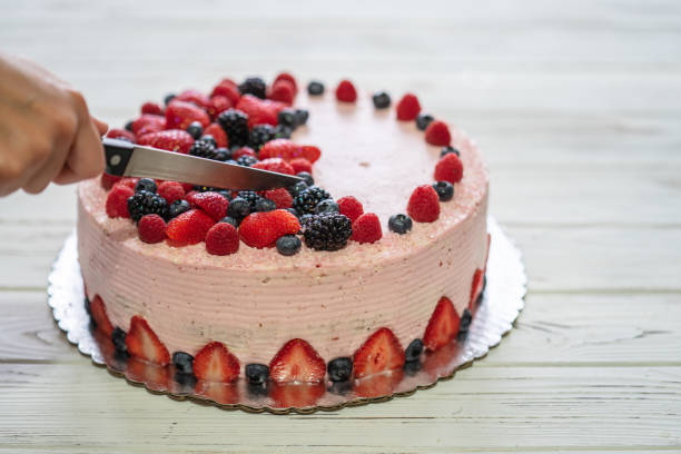 istock Home made cake with berries. Cake with Strawberry, blackberry, blueberry, and raspberry on a table 1283374330