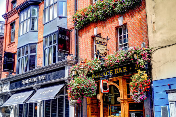 Colourful pubs with hanging flower planters in the Temple Bar district of Dublin Ireland Dublin, Ireland - July 11, 2019: Colourful pubs with hanging flower planters in the Temple Bar district of Dublin Ireland temple bar pub stock pictures, royalty-free photos & images