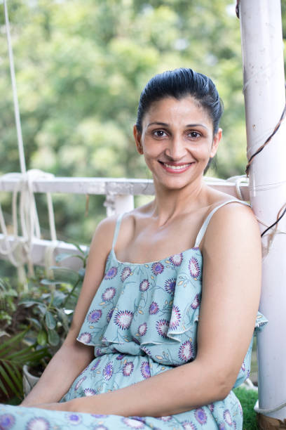 istock Woman sitting at balcony 1283379599