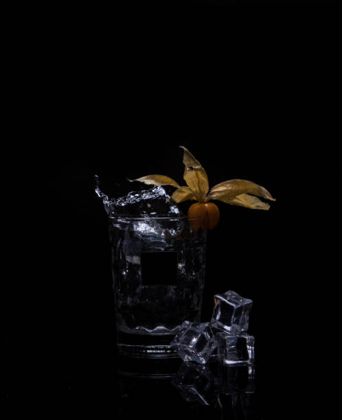 istock Splashing drink on a black background 1283379843