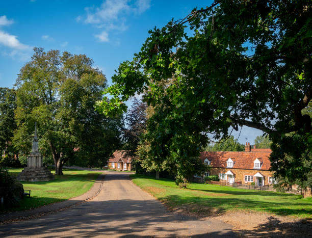 istock War memorial and cottages in Castle Rising, Norfolk 1283379992