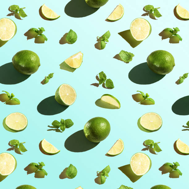 istock Seamless texture of lime with mint on a blue background. Top view. 1283382412