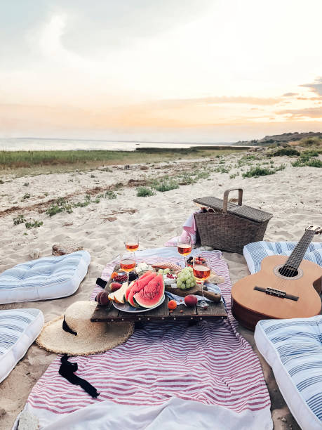 istock Delicious food on table on beach 1283382590