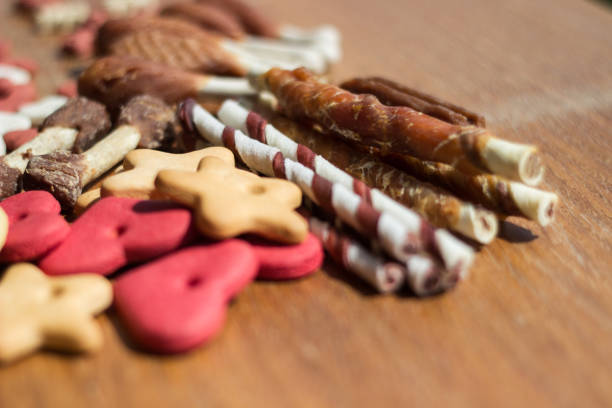 istock Dog tasty colored biscuits on wooden background 1283384965