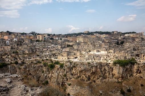 Panoramic view of Sassi di Matera a historic district in the city of Matera, well-known for their ancient cave dwellings from the Belvedere di Murgia Timone,  Basilicata, Italy