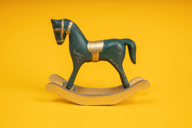 istock Blue vintage rocking horse on yellow background 1283386202