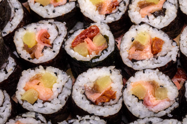 istock Top view of stack of Japanese sushi maki roll plate. 1283389712