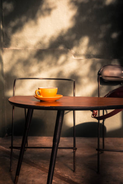 istock Specialty filter coffee in yellow cup on a wooden table 1283391011