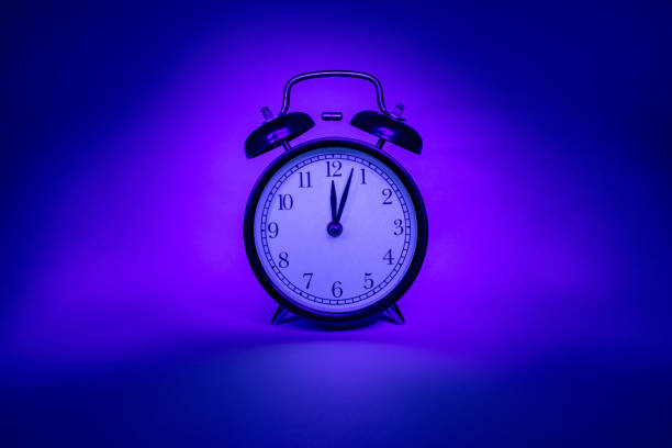 istock Isolated Clock on the blue - pink background 1283392483