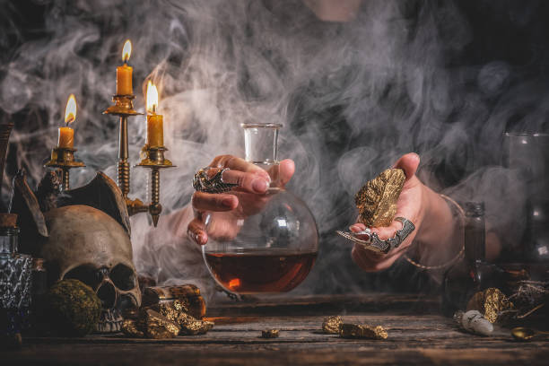 Alchemist. Alchemist is working by his magic table. alchemy stock pictures, royalty-free photos & images