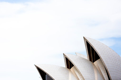 Sydney, Australia - September 13, 2020: Closeup roofline 'The sails' of Sydney's Opera House against blue sky, Australia, full frame horizontal composition with copy space