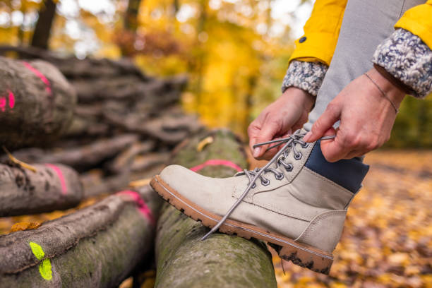 istock Hiker ties shoelaces on her leather hiking boot 1283397347