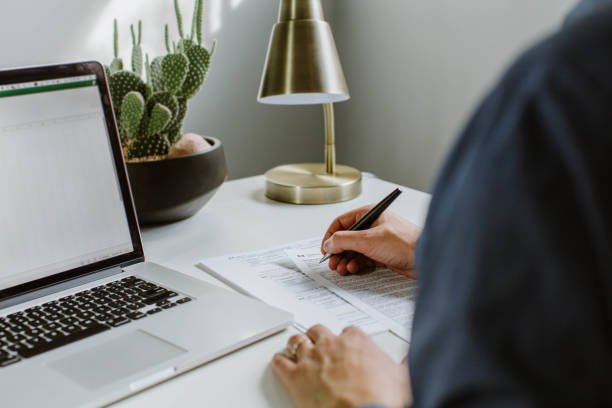 istock Filling out Canadian tax documents 1283398722