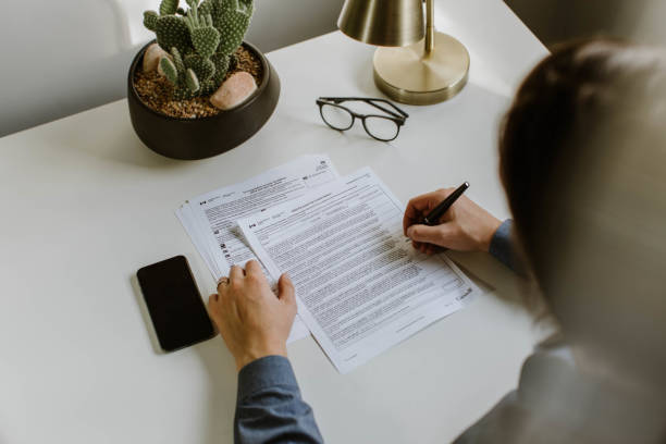 istock Filling out Canadian tax documents 1283398758