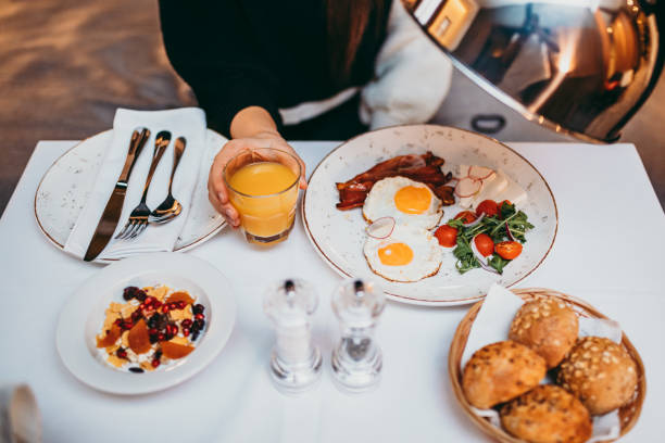 istock Young woman having breakfast at bedroom 1283399851