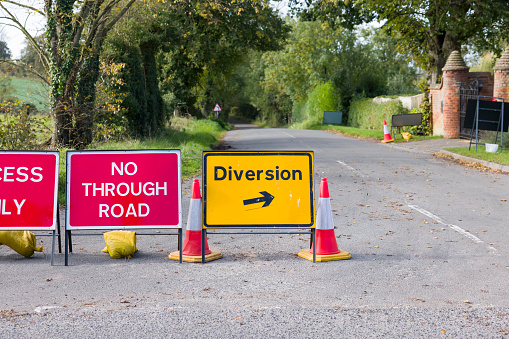 UK yellow diversion sign and road closed signs on a country road in Buckinghamshire