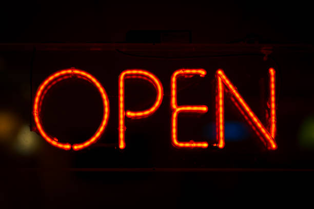 istock Open neon sign in red with dark background 1283402036