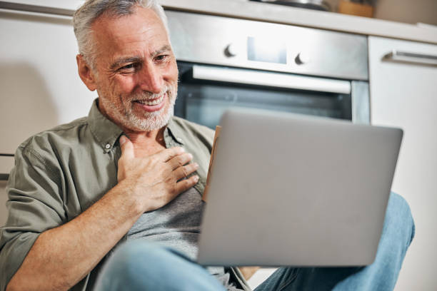 istock Elderly man looking thankful while having a video call 1283402188