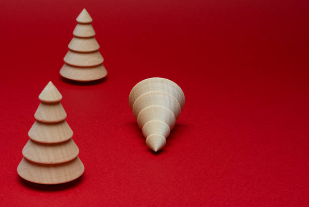 istock Wooden Christmas tree figurine on a red background. Copy space. 1283403301