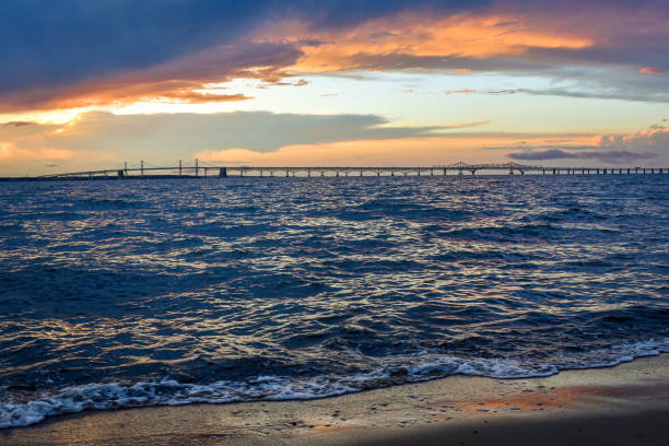 Sunset and dramatic sky at Chesapeake Bay Bridge stock photo