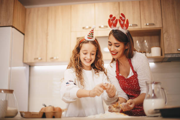 istock Two girls mixing ingredients. New Year concept. 1283405729