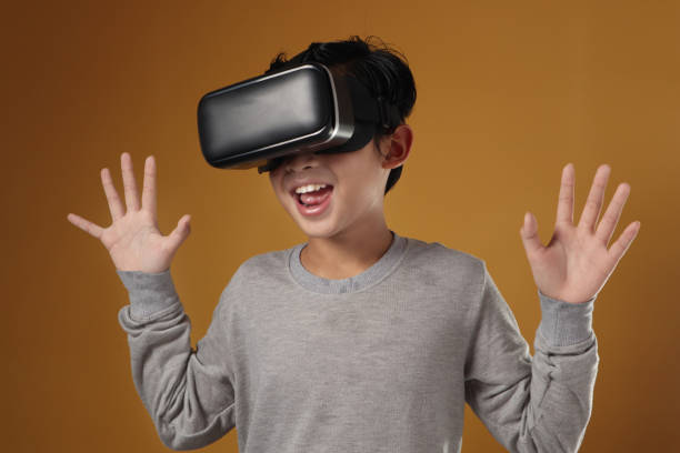 Boy Looks Fascinated Into Virtual Reality Headset Stock Photos, Pictures &  Royalty-Free Images - iStock