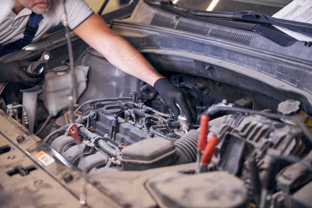 istock Auto mechanic fixing car engine at service station 1283409933