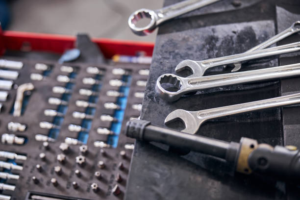 istock Auto repair kit and wrenches at car service station 1283409986