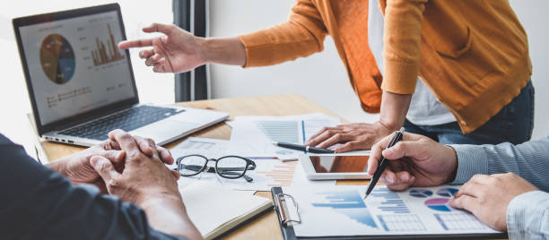 istock Business team collaboration discussing working analyzing with financial data and marketing growth report graph in team, presentation and brainstorming to strategy planning making profit of company 1283414345