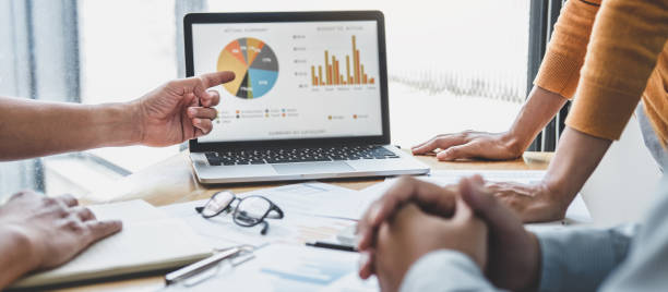 istock Business team collaboration discussing working analyzing with financial data and marketing growth report graph in team, presentation and brainstorming to strategy planning making profit of company 1283414348