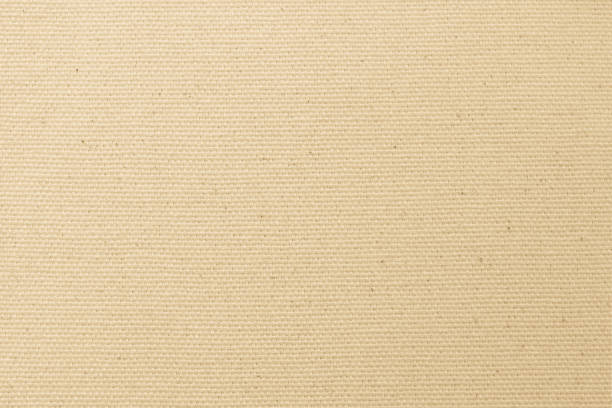 istock Hessian sackcloth woven texture pattern background in light yellow cream brown color 1283414442