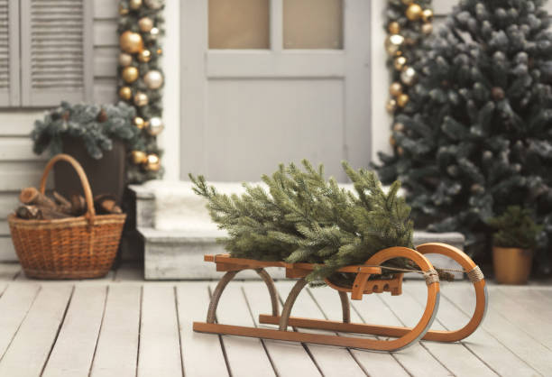 istock House christmas retro decorations in gold and silver colors. Sled with tree 1283414456