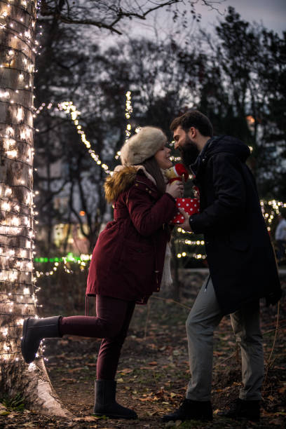 istock Intimate couple sharing Christmas season together 1283414504