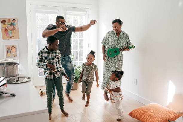 istock family dancing indoor 1283414630